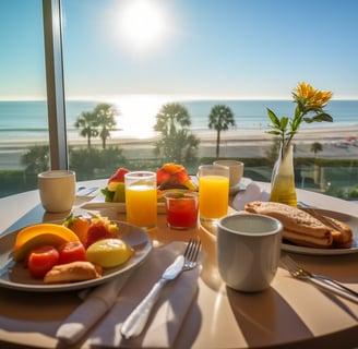 a table with a plate of food and a vase with flowers overlooking Kihei beach