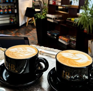 two cups of coffee on a tray