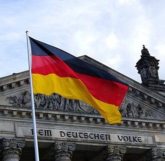 a large flag flying in front of a building