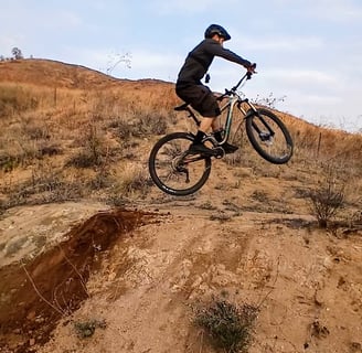 Small Takeoff: Beginner mountain bike jump with small dirt takeoff