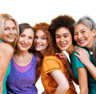 a group of women who are all smiling and posing for a picture