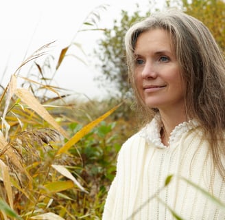 a woman in a white sweater and a white sweater