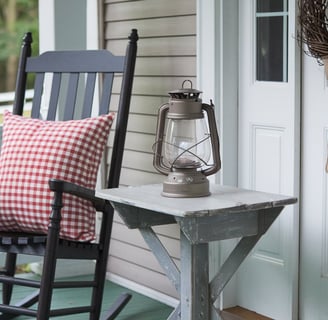 Lean into the warmth of country-inspired decor with distressed wood furniture, gingham patterns