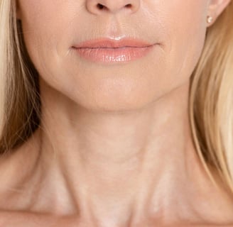 a woman with blonde hair and a white shirt