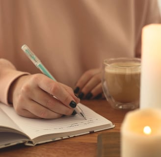 a person writing a notepad with a pen and a pen