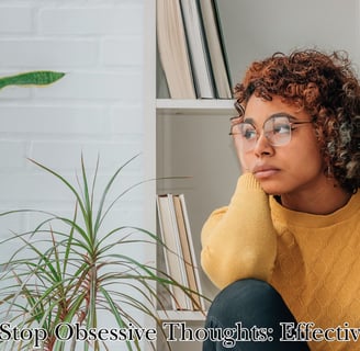 a woman sitting on a chair with a plant in front of her