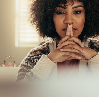 Black woman with hands together