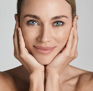 a woman with her hands cupped on her face