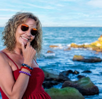 a woman in a red dress and sunglasses