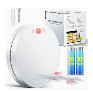 a white smoke detector with a battery and batteries