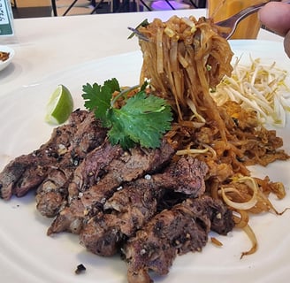 a plate of food with noodles and noodles