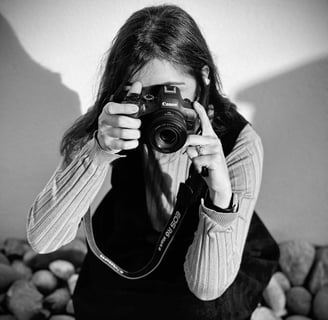 a woman taking a picture of herself taking a picture of herself