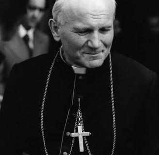 a man in a priest's robes and a cross on a cross - stitch