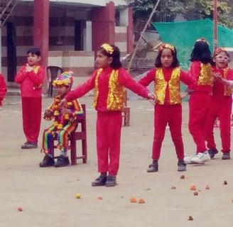 a group of young girls in red and yellow uniforms