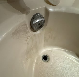 Worn Bathtub from Water Leak that needs to be glazed or replaced by At Hand Heroes in Peoria