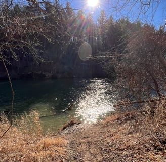 a river being Sunkissed by rays of the sun.