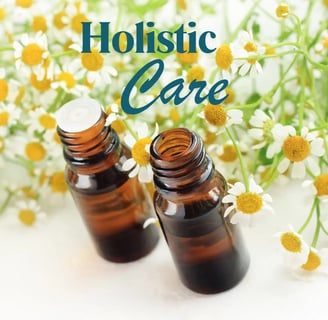 2 bottles of essential oils and "Holistic Care" written to advertise menopause coaching