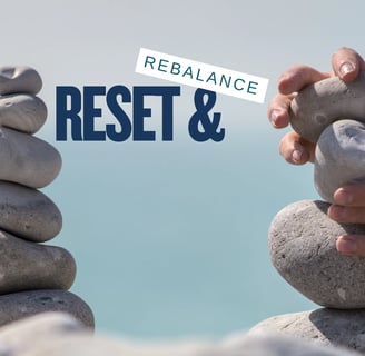 two piles of stones either side of a blue background with Reset and rebalance written in the gap between the piles