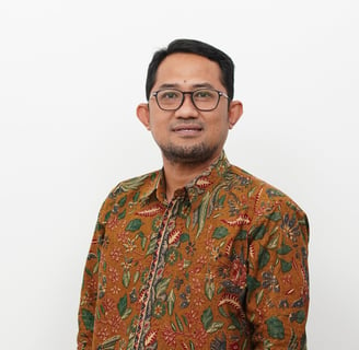 a man in a floral shirt and glasses