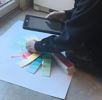 marcine selecting colors for a bespoke mural in nj