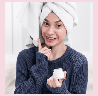 a woman with a towel on her head and a towel wrapped around her head