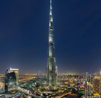 a tall building with a tall tower in the middle of it