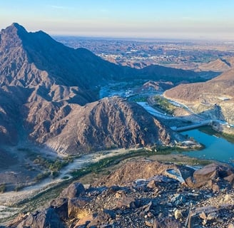 a mountain view of a river and mountains