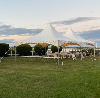 20x49 white tent, outdoor event, tables, chairs