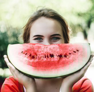 a person smiling from eating healthy