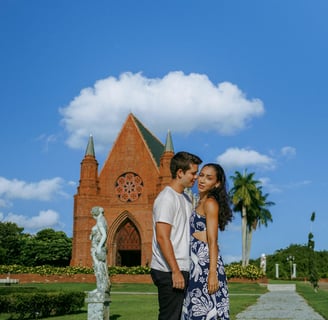 a man and woman standing in front of a church