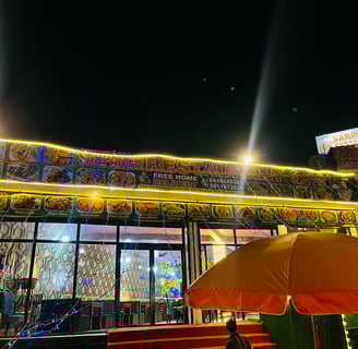 a restaurant with a large open air condition in Sarpanch Restaurant Bareilly Fatehganj