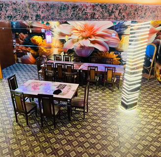 a restaurant with a large mural of flowers in Sarpanch Restaurant Bareilly Fatehganj
