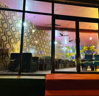 a restaurant with a large window and Sarpanch Restaurant Bareilly Fatehganj
