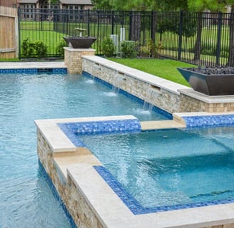 Close-up of luxury pool tile and cascading water feature in a Palo Alto backyard