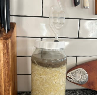 sauerkraut fermenting in a glass jar