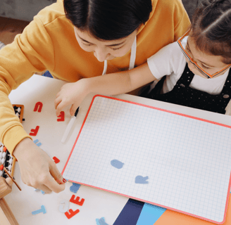 mother and daughter working on homeschool project together