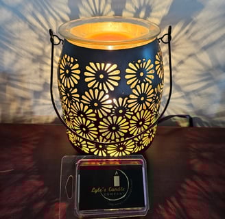 a candle lit up with a candle in a glass jar