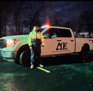 Security guard standing up Infront of a truck