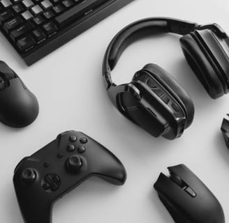 a keyboard, mouse, and headphones on a desk