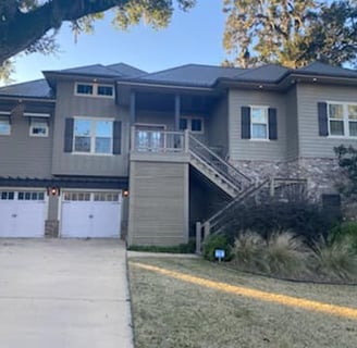 a house with a driveway and garage door