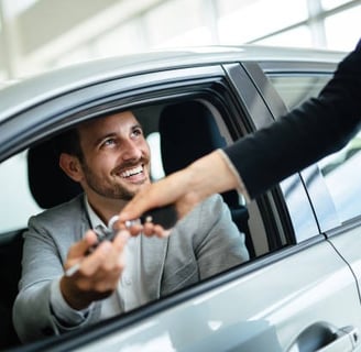  Happy customer because he just bought a car on lease.