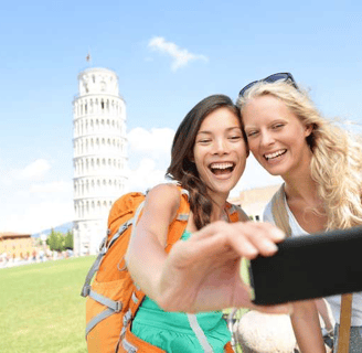 two women taking a selfie with a camera