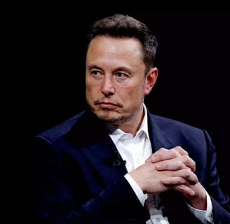 a man in a suit and tie is holding a cell phone