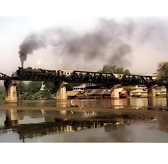 Stream Train crossing the Bridge on the river Kwai in Kanchanaburi , 2024 Toursofwar.com