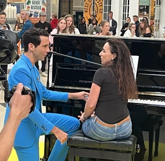 Mika talking to Helen Spooner after her performance on The Piano on Channel 4 at Brighton Station