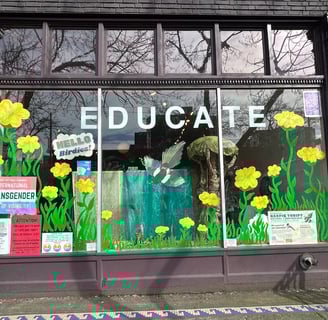 Exterior photo of Magpie Thrift window with flowers painted on it