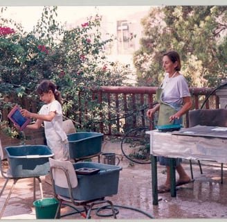 Chava teaching her granddaughter the craft of papermaking