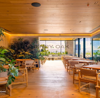 a restaurant with a wooden table and chairs