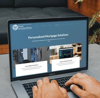 A laptop computer showing Coast Investment Realty website