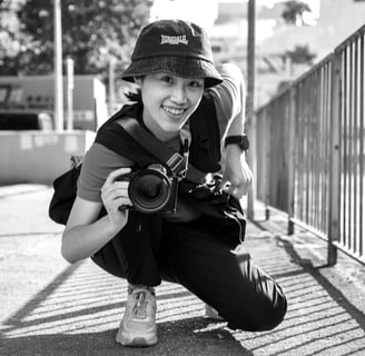 Young female street photographer with camera 